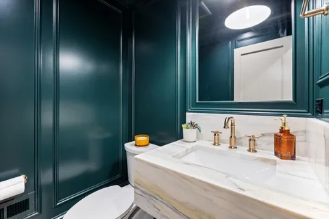 a large kitchen with a table and chairs