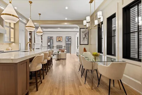 a open kitchen with stainless steel appliances granite countertop a stove a sink and a refrigerator