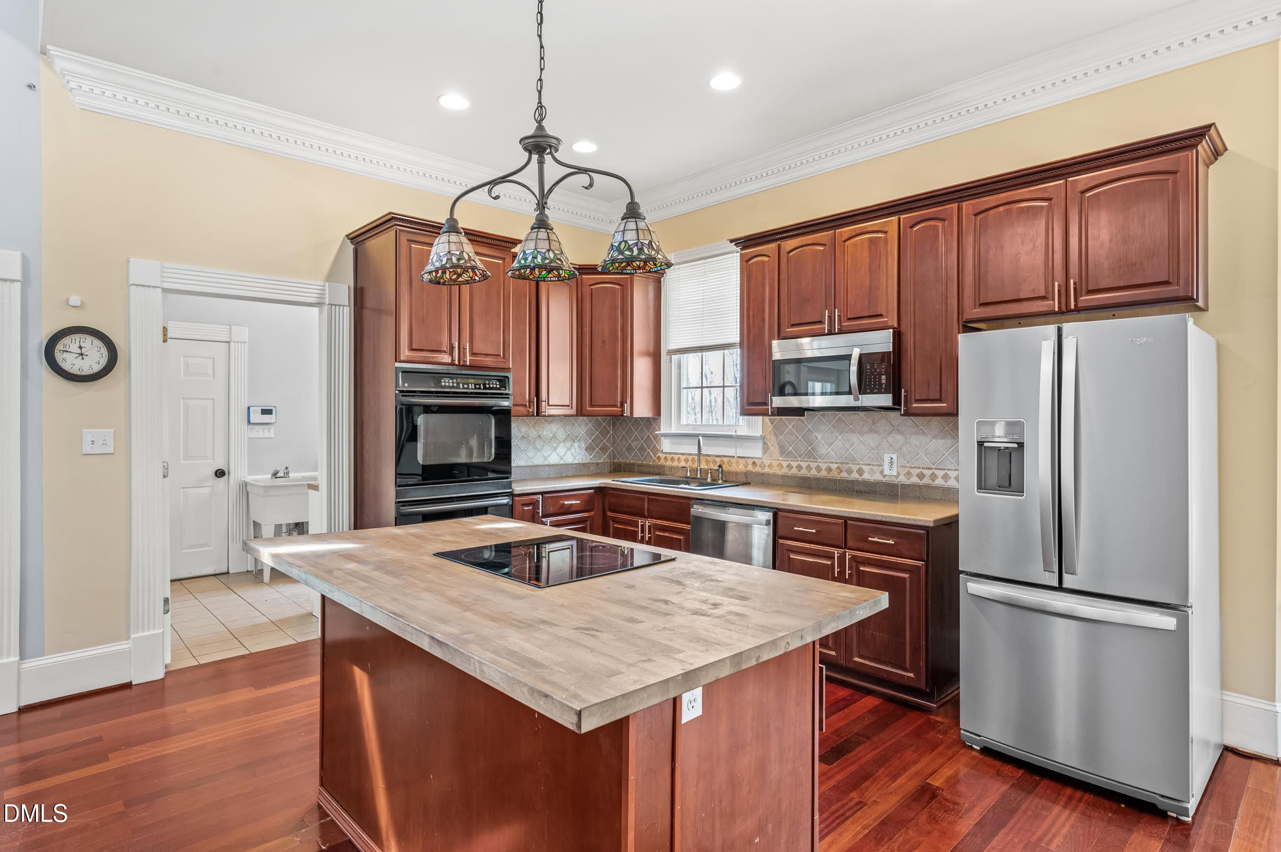 1957 Hilltop Road Raleigh, NC 27610 - Photo 14 of 46 a kitchen with stainless steel appliances granite countertop a sink refrigerator stove and microwave