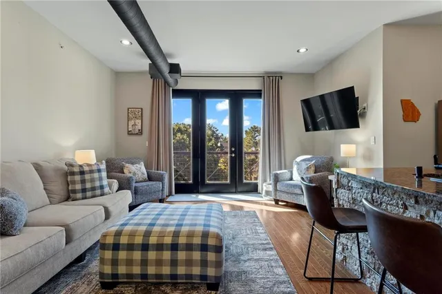 a living room with furniture and a flat screen tv