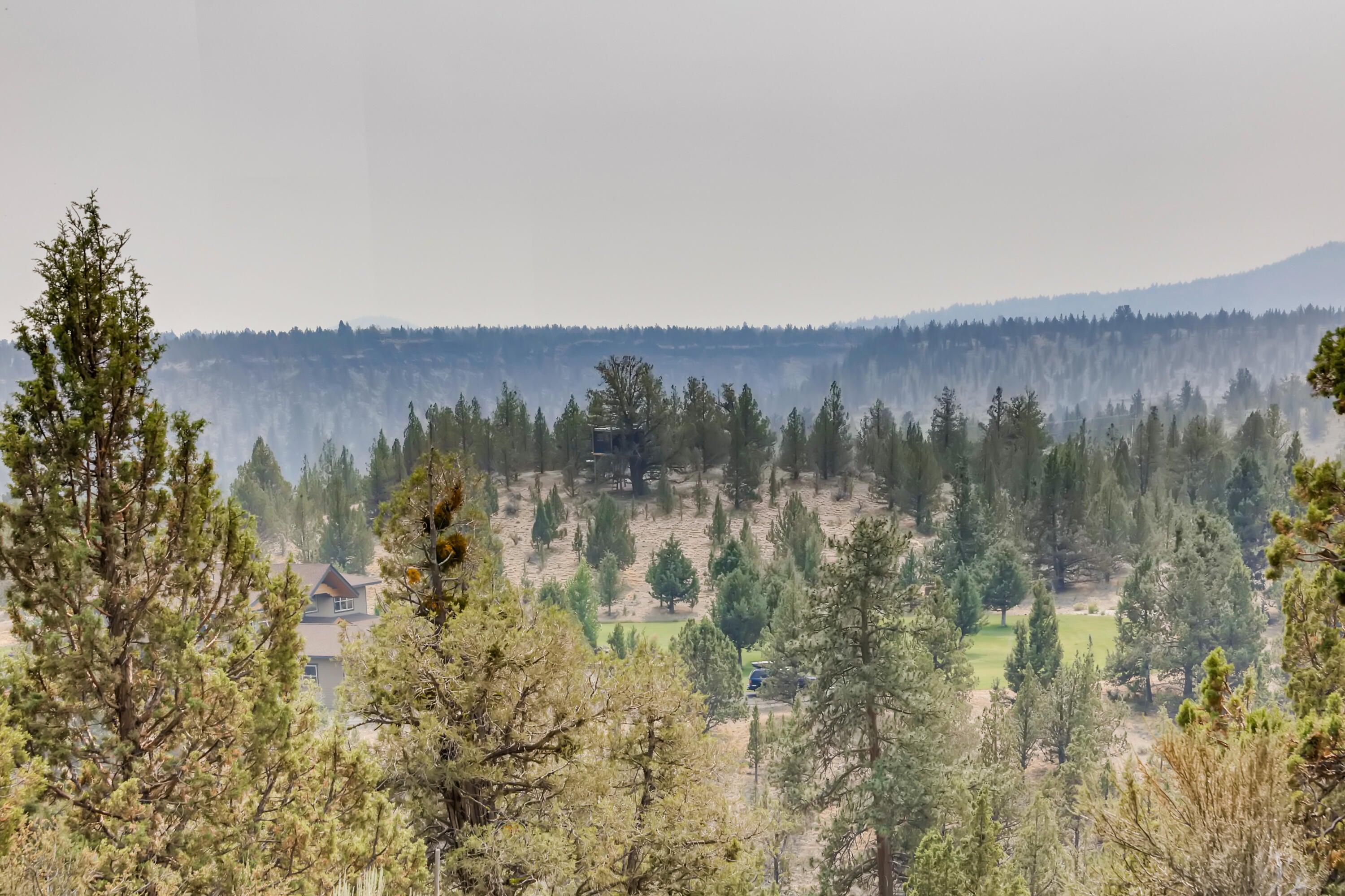 19695 Ridgewood Drive Bend, OR 97703 - Photo 21 of 21 A great view from the back deck, even with the smoke from the fires! On a clear day, you can see Mt. Bachelor and Awbrey Butte. City lights can be seen at night.