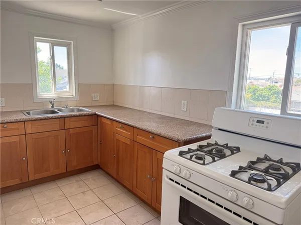 a kitchen with a stove and a sink
