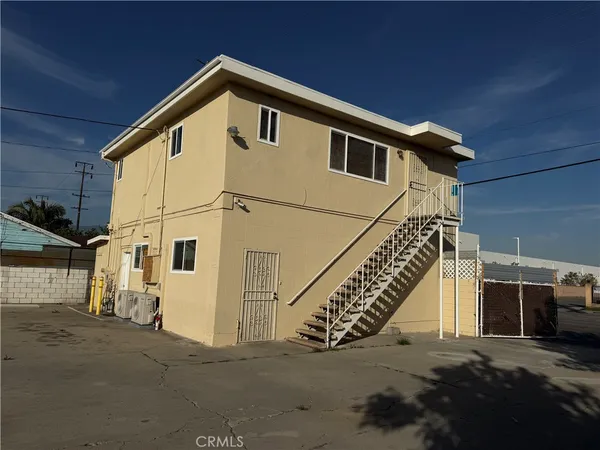 a view of a house with a street
