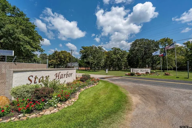 a view of a swimming pool and a yard