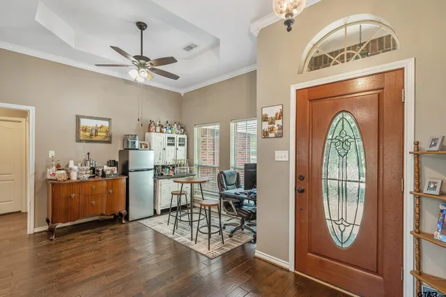 a view of a livingroom with furniture and a window