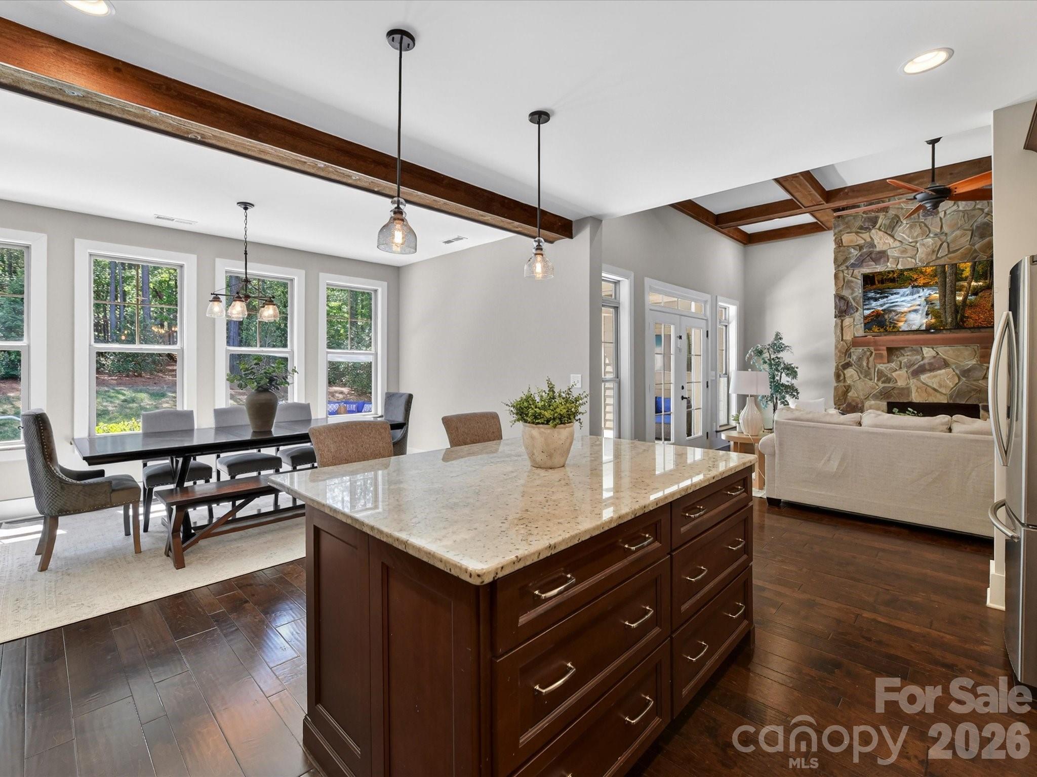 205 Streamwood Road Troutman, NC 28166 - Photo 15 of 41 a room with a table chairs and wooden floor
