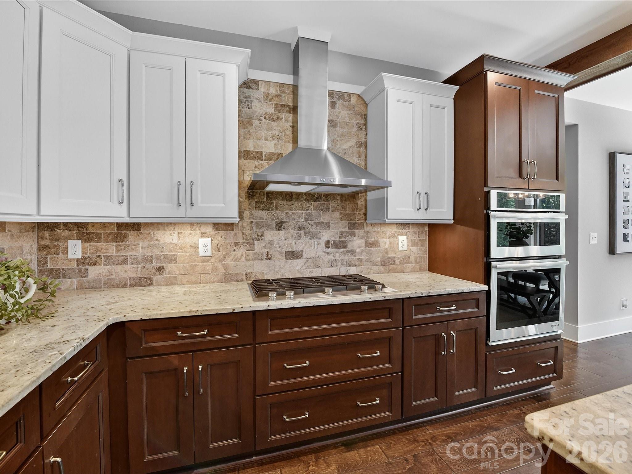 205 Streamwood Road Troutman, NC 28166 - Photo 16 of 41 a kitchen with stainless steel appliances granite countertop a stove a sink and a microwave