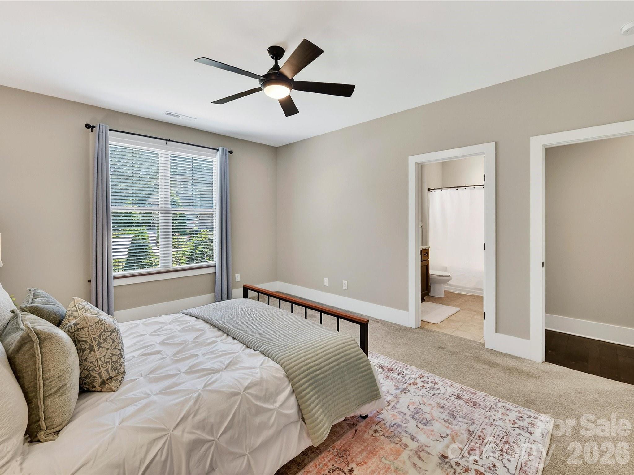 205 Streamwood Road Troutman, NC 28166 - Photo 25 of 41 a bedroom with a large bed and a window