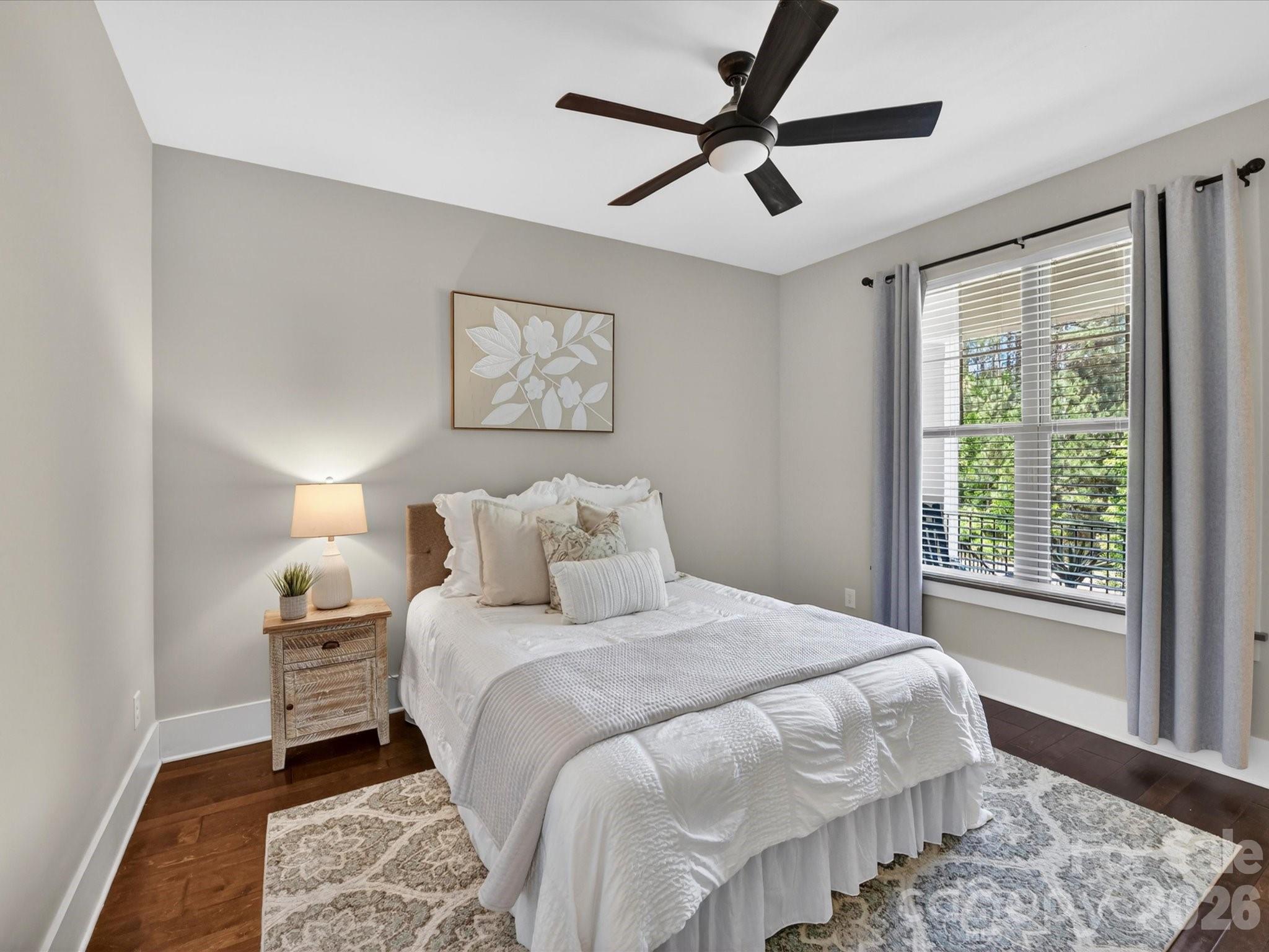 205 Streamwood Road Troutman, NC 28166 - Photo 27 of 41 a bedroom with a large bed and a window