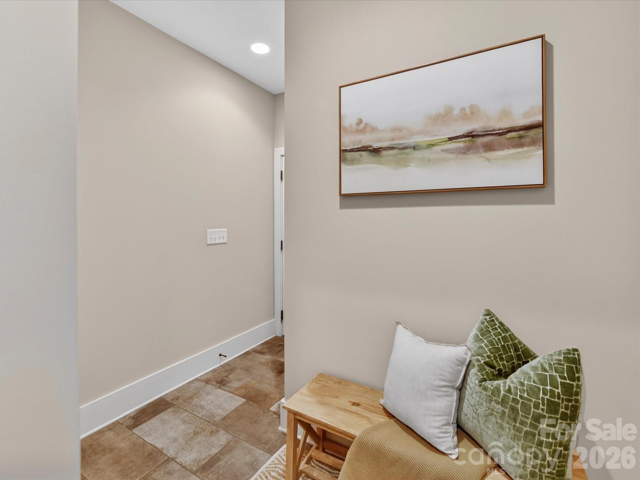 205 Streamwood Road Troutman, NC 28166 - Photo 34 of 41 a living room with furniture and a wall