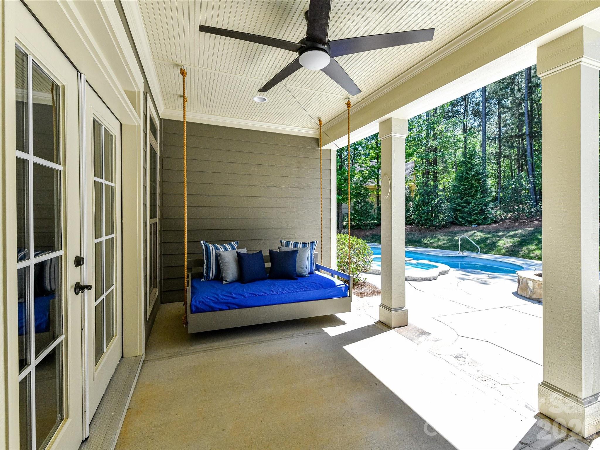 205 Streamwood Road Troutman, NC 28166 - Photo 36 of 41 a bedroom with furniture and large windows