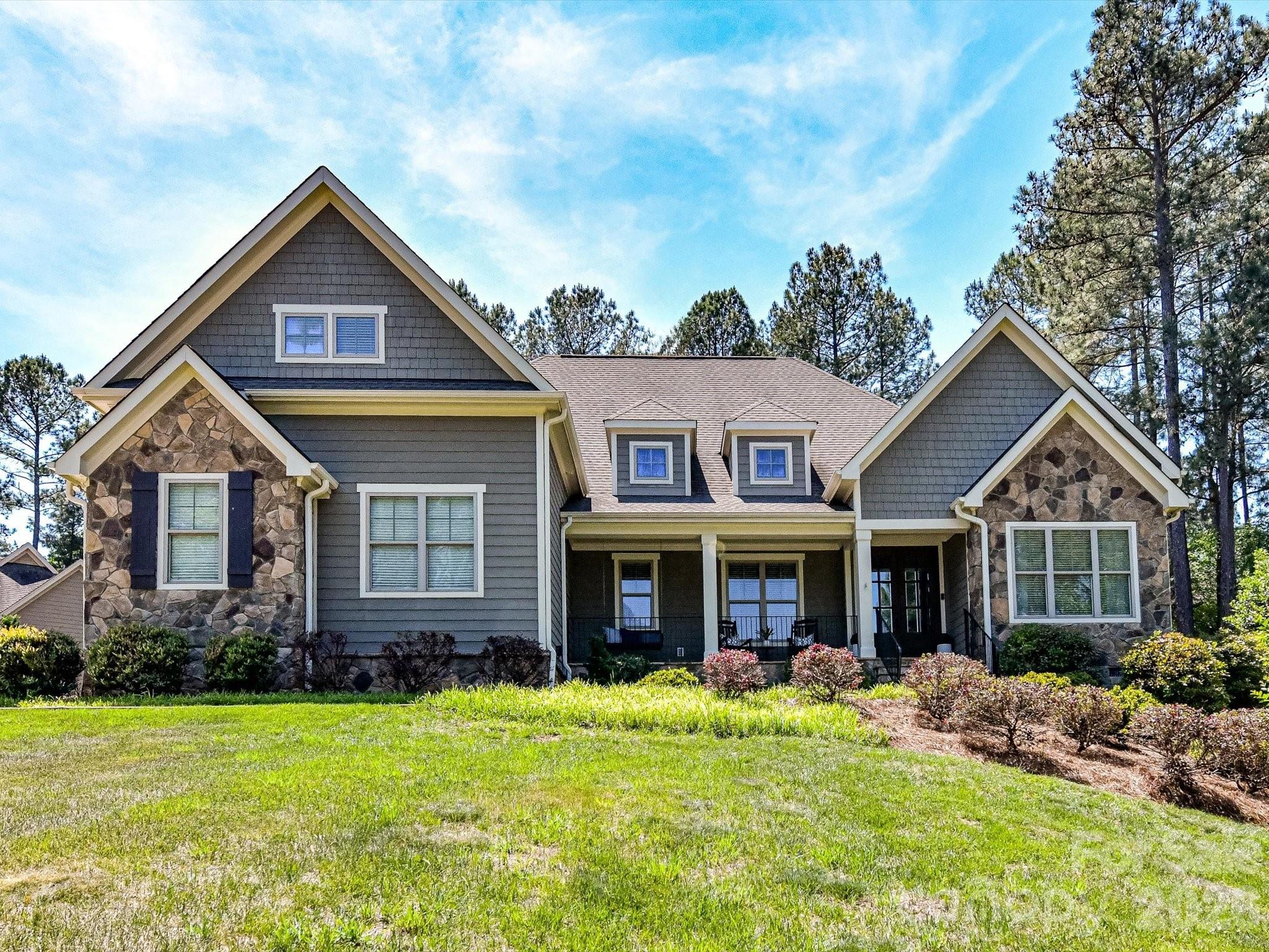 205 Streamwood Road Troutman, NC 28166 - Photo 5 of 41 a front view of a house with a yard