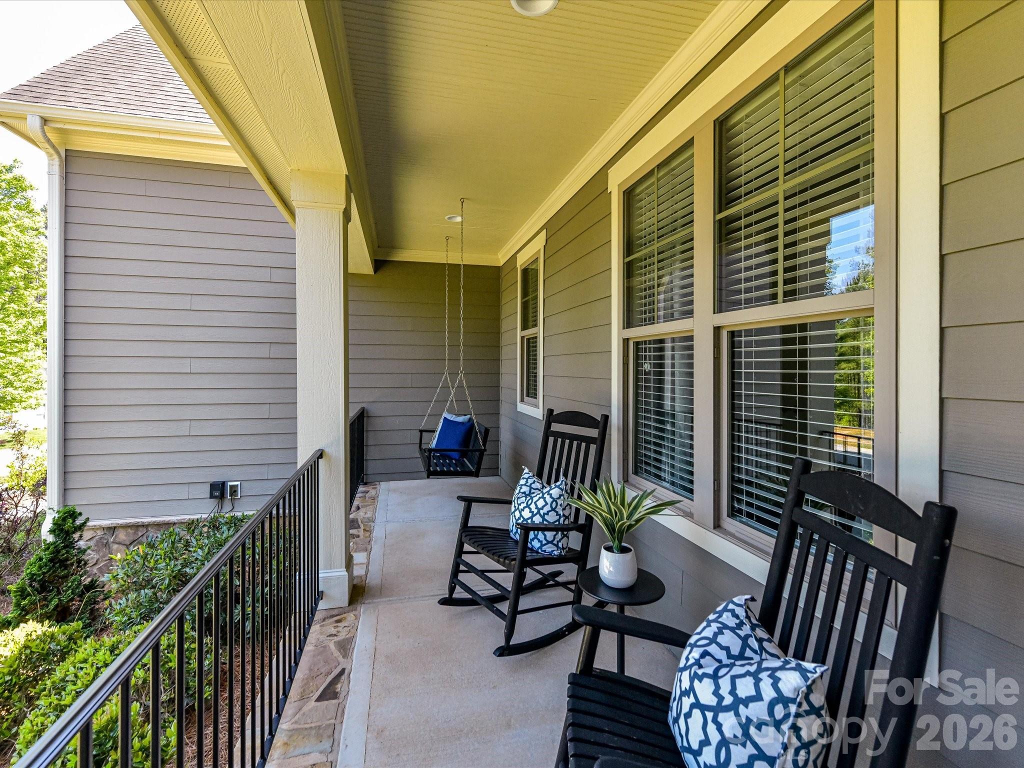 205 Streamwood Road Troutman, NC 28166 - Photo 6 of 41 a balcony with furniture and wooden floor