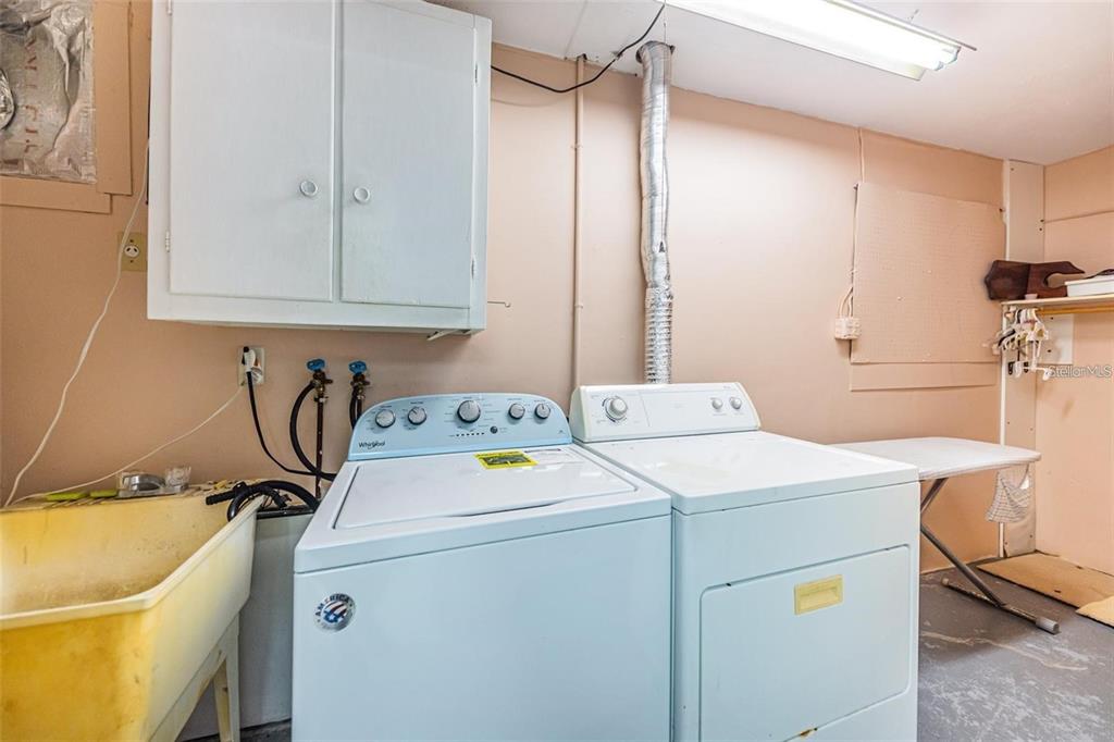 4902 Vision Avenue Holiday, FL 34690 - Photo 19 of 25 a utility room with dryer and washer