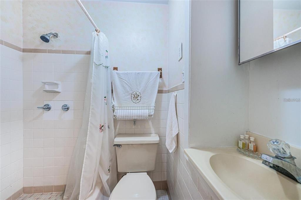 4902 Vision Avenue Holiday, FL 34690 - Photo 20 of 25 a white toilet sitting next to a bathroom sink