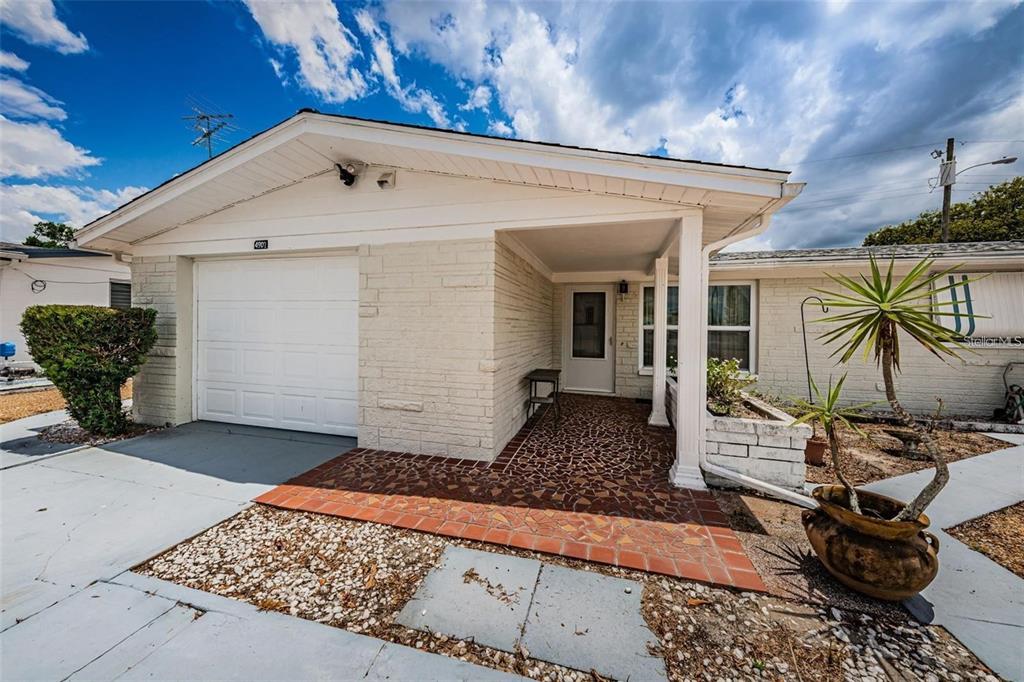 4902 Vision Avenue Holiday, FL 34690 - Photo 2 of 25 a view of a front door and a couch