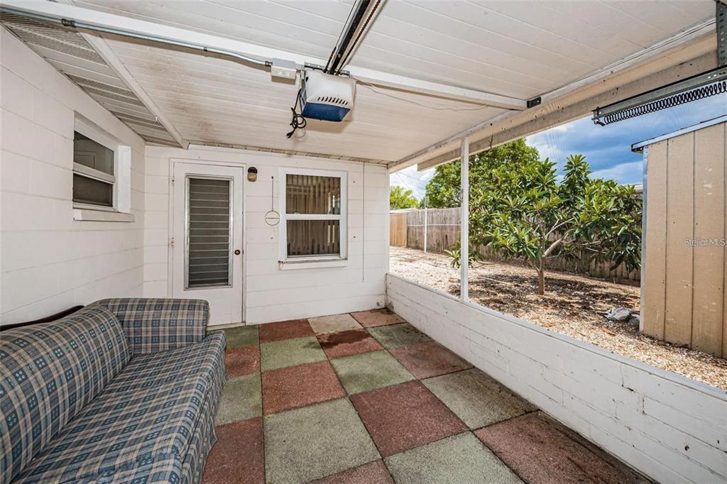 4902 Vision Avenue Holiday, FL 34690 - Photo 22 of 25 a view of a porch with a bench