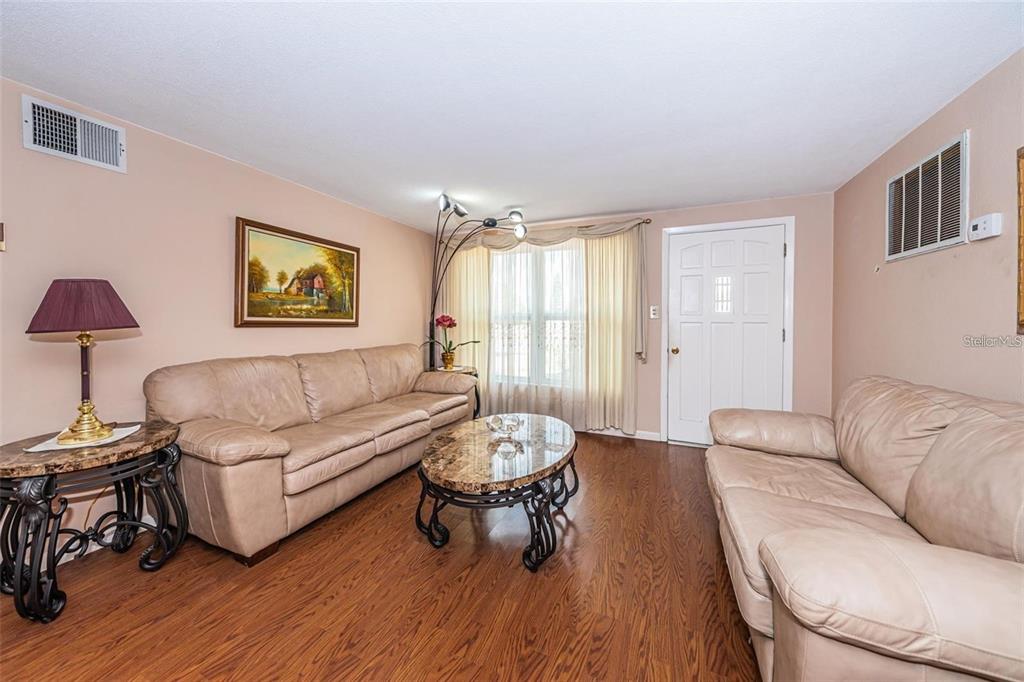 4902 Vision Avenue Holiday, FL 34690 - Photo 6 of 25 a living room with furniture and a large window
