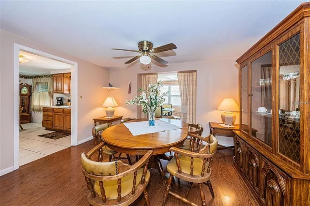 a living room with furniture a dining table and chairs