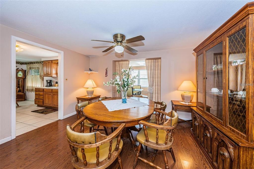 4902 Vision Avenue Holiday, FL 34690 - Photo 10 of 25 a living room with furniture a dining table and chairs