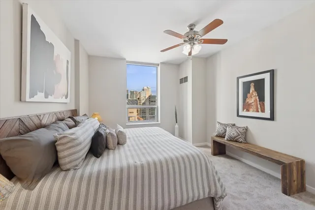 a bedroom with a bed and window