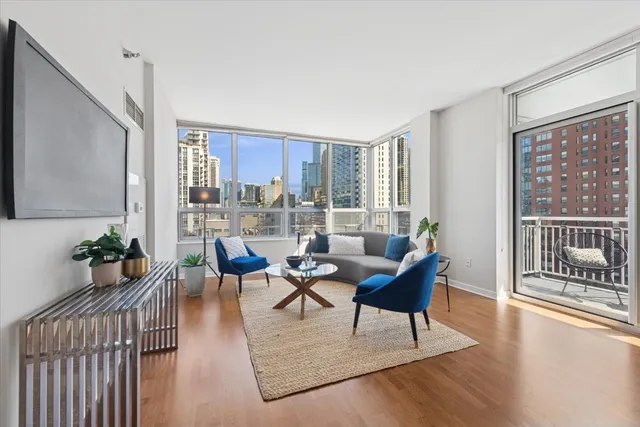 a living room with furniture and a large window