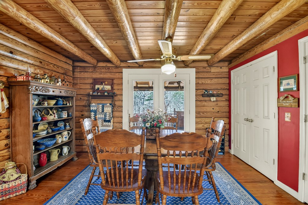 7233 Shakerag Road Ellijay, GA 30540 - Photo 15 of 117 a view of a dining room with furniture window and wooden floor