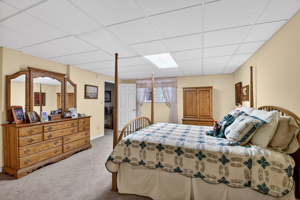 7233 Shakerag Road Ellijay, GA 30540 - Photo 22 of 117 a bedroom with a large bed and wooden floor