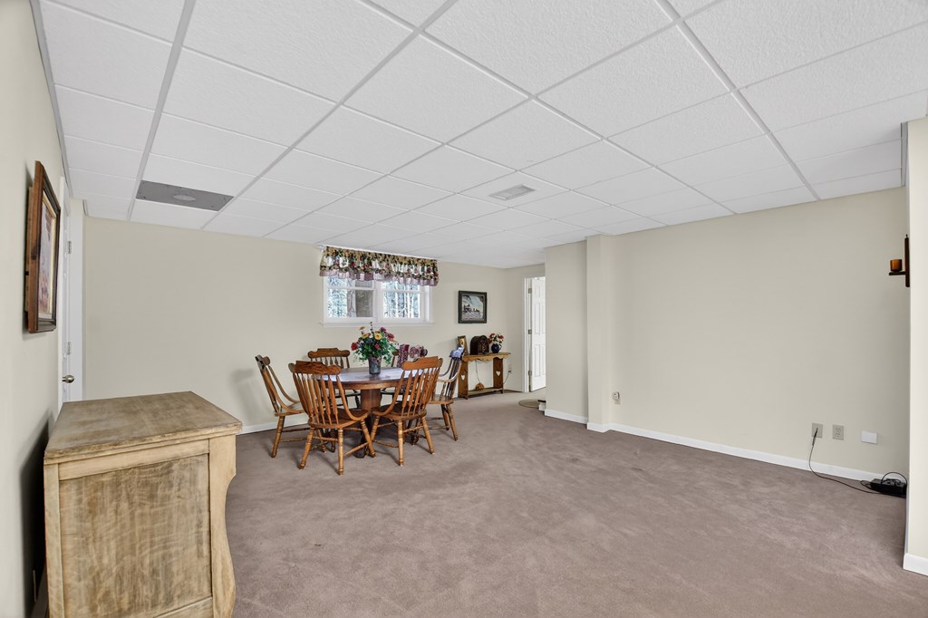 7233 Shakerag Road Ellijay, GA 30540 - Photo 36 of 117 a view of a dining room with furniture and chandelier