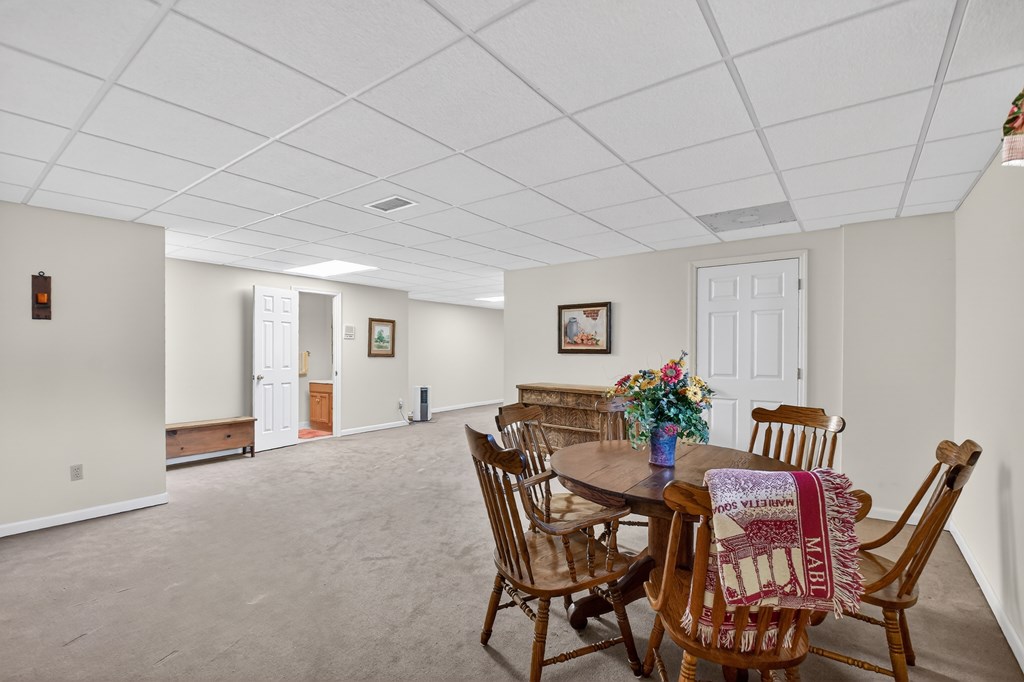 7233 Shakerag Road Ellijay, GA 30540 - Photo 37 of 117 a view of a dining room with furniture and wooden floor