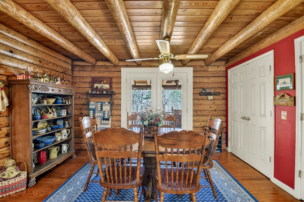 7233 Shakerag Road Ellijay, GA 30540 - Photo 66 of 117 a view of a dining room with furniture window and wooden floor