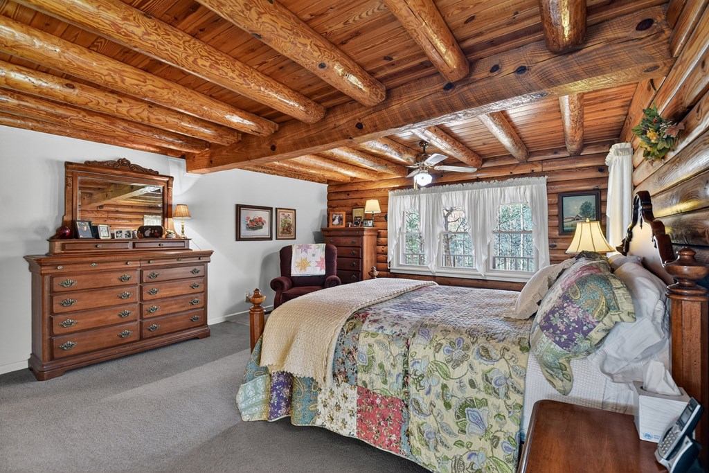 7233 Shakerag Road Ellijay, GA 30540 - Photo 76 of 117 a bed room with a bed and a walk in closet