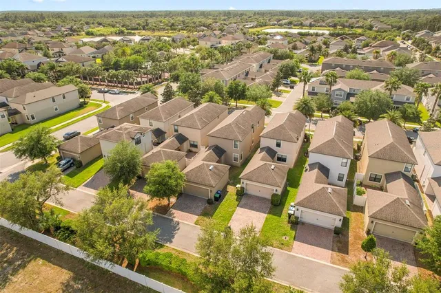an aerial view of a house with a garden