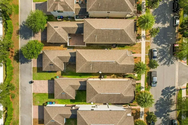 an aerial view of residential building and parking space