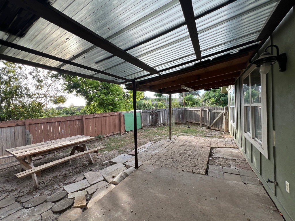 10510 Little Pebble Drive, Unit B Austin, TX 78758 - Photo 14 of 15 a view of a backyard with wooden fence