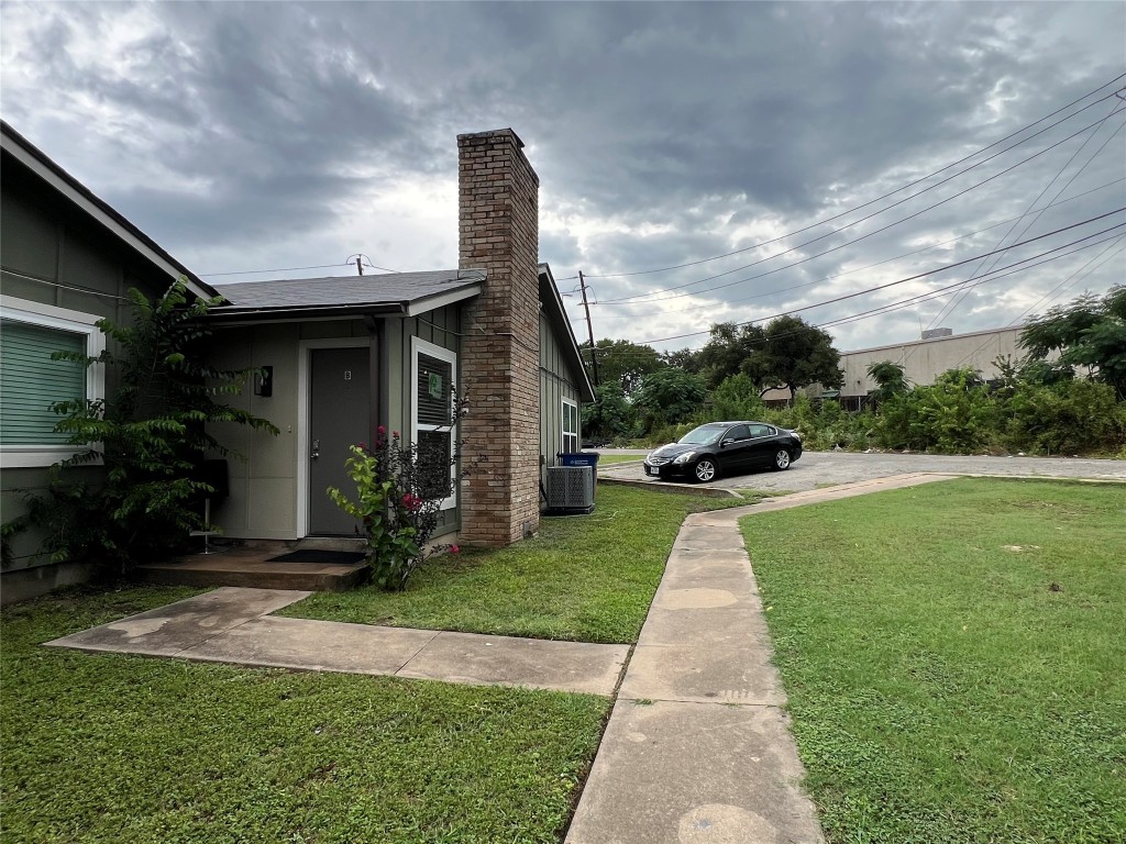 10510 Little Pebble Drive, Unit B Austin, TX 78758 - Photo 15 of 15 a front view of a house with a yard