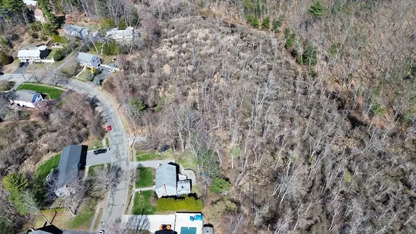 an aerial view of residential house with outdoor space