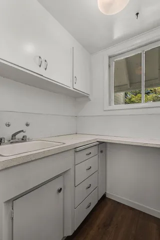 a utility room with cabinets