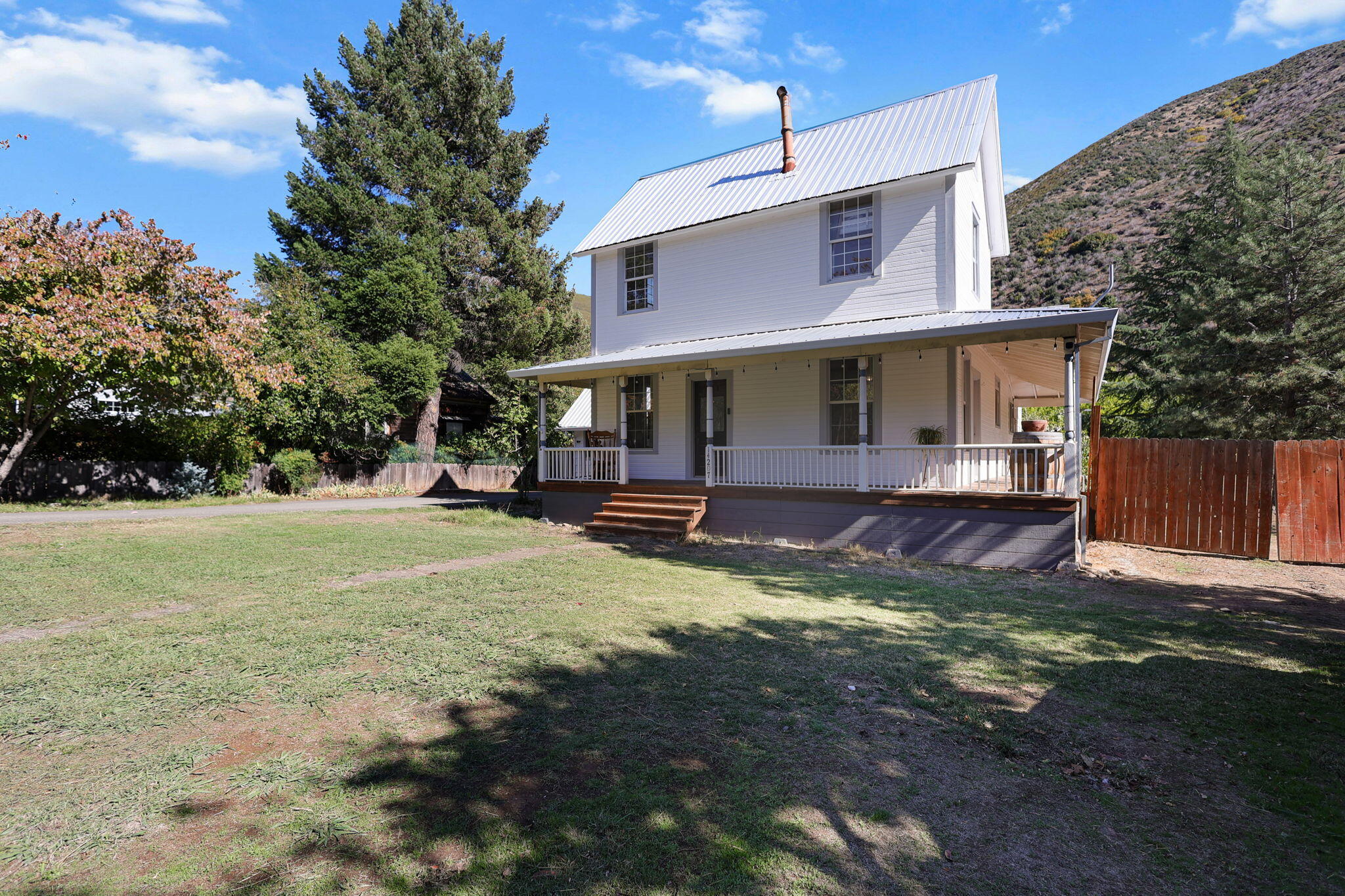 14207 Main Street French Gulch, CA 96033 - Photo 34 of 38 a view of a house with backyard and trees