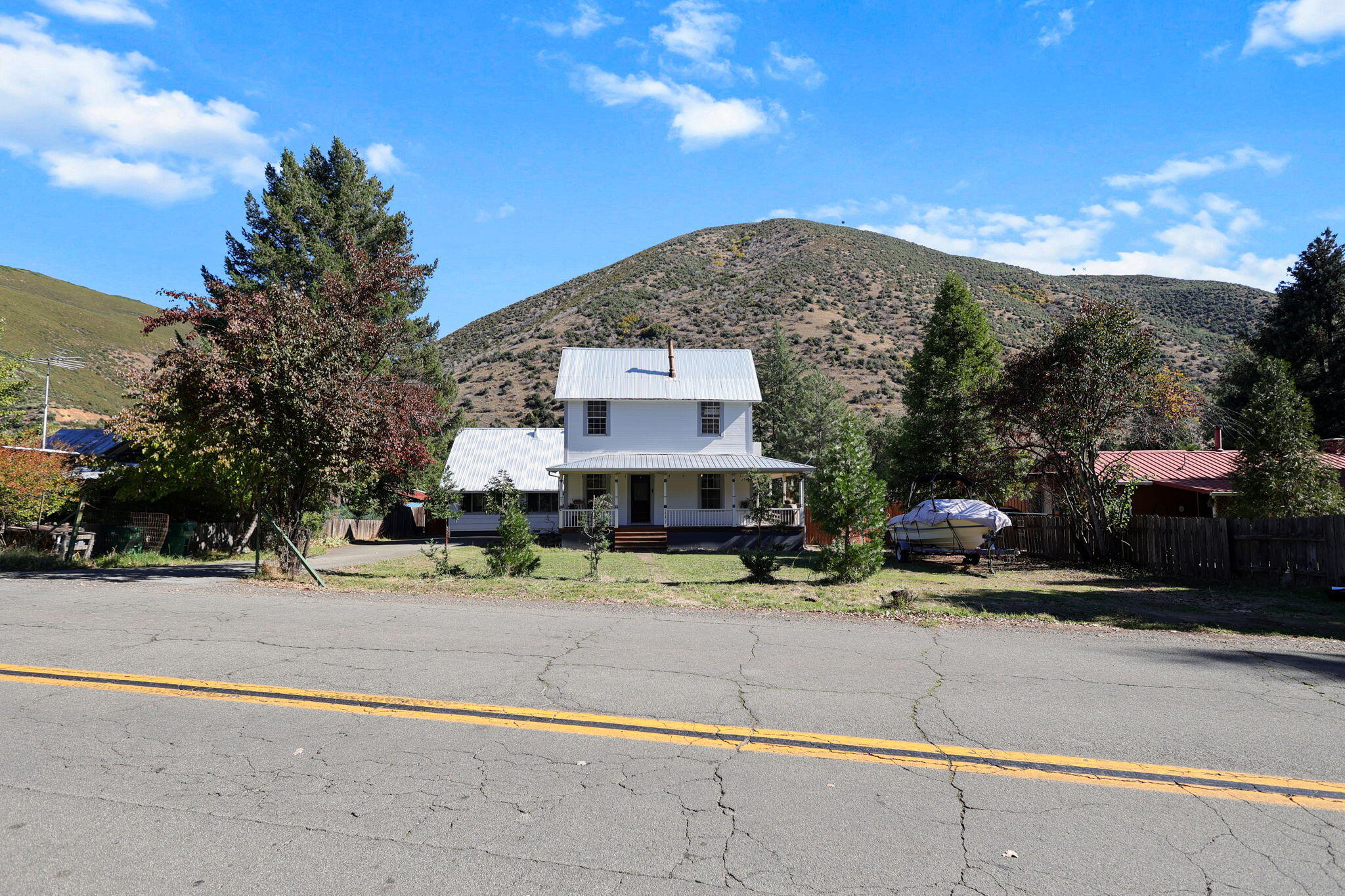 14207 Main Street French Gulch, CA 96033 - Photo 36 of 38 a front view of a house with a yard and garage