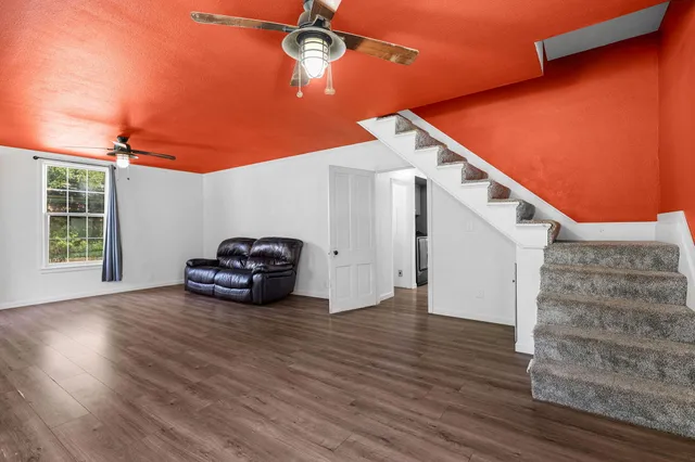 a view of a livingroom with wooden floor