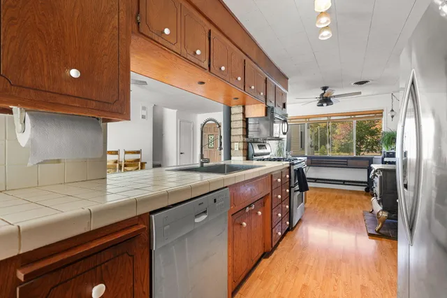 a bathroom with a sink and a large mirror