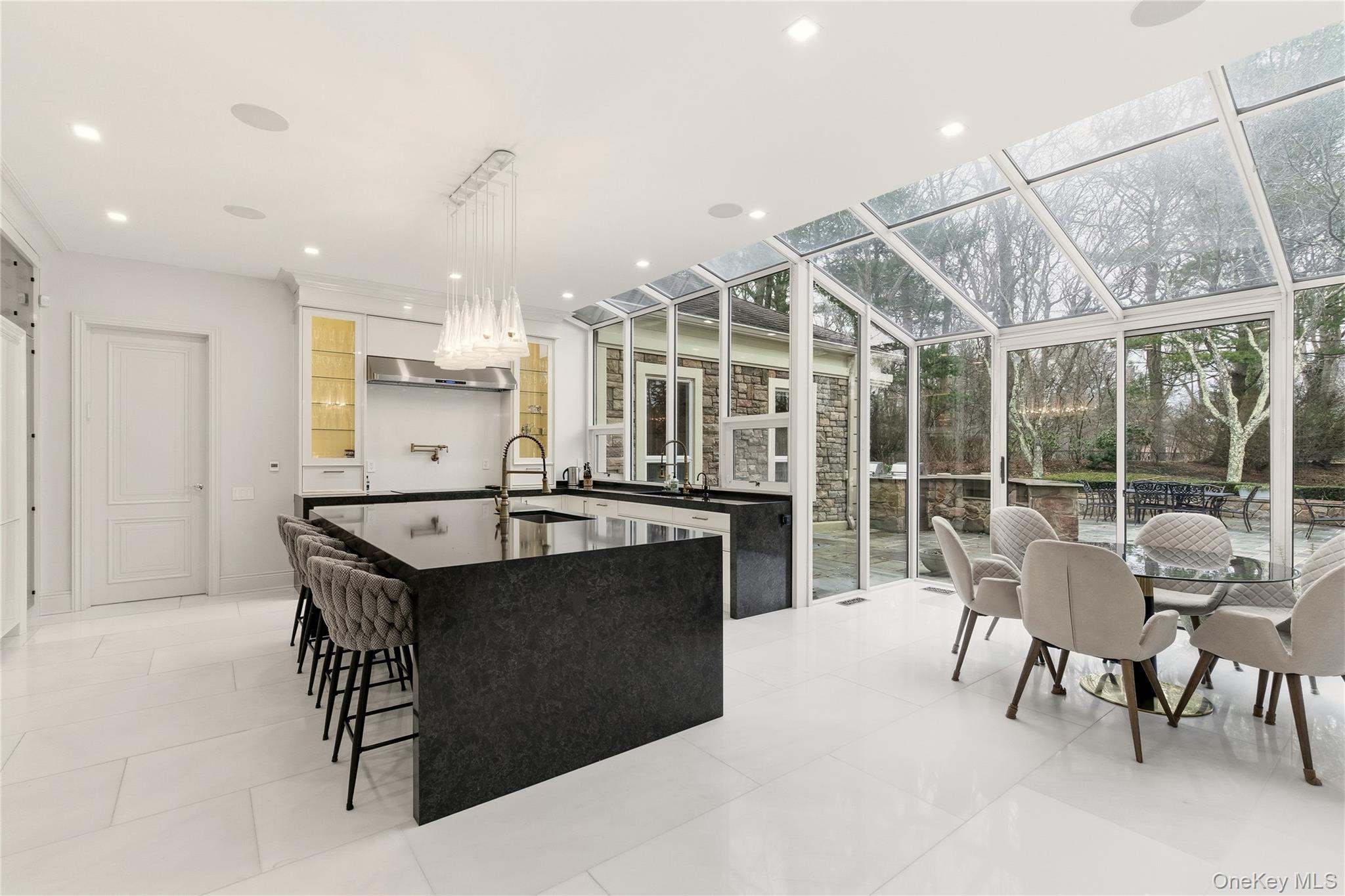 55 Coves Run Syosset, NY 11791 - Photo 13 of 50 a view of a kitchen with kitchen island granite countertop lots of counter top space and breakfast area