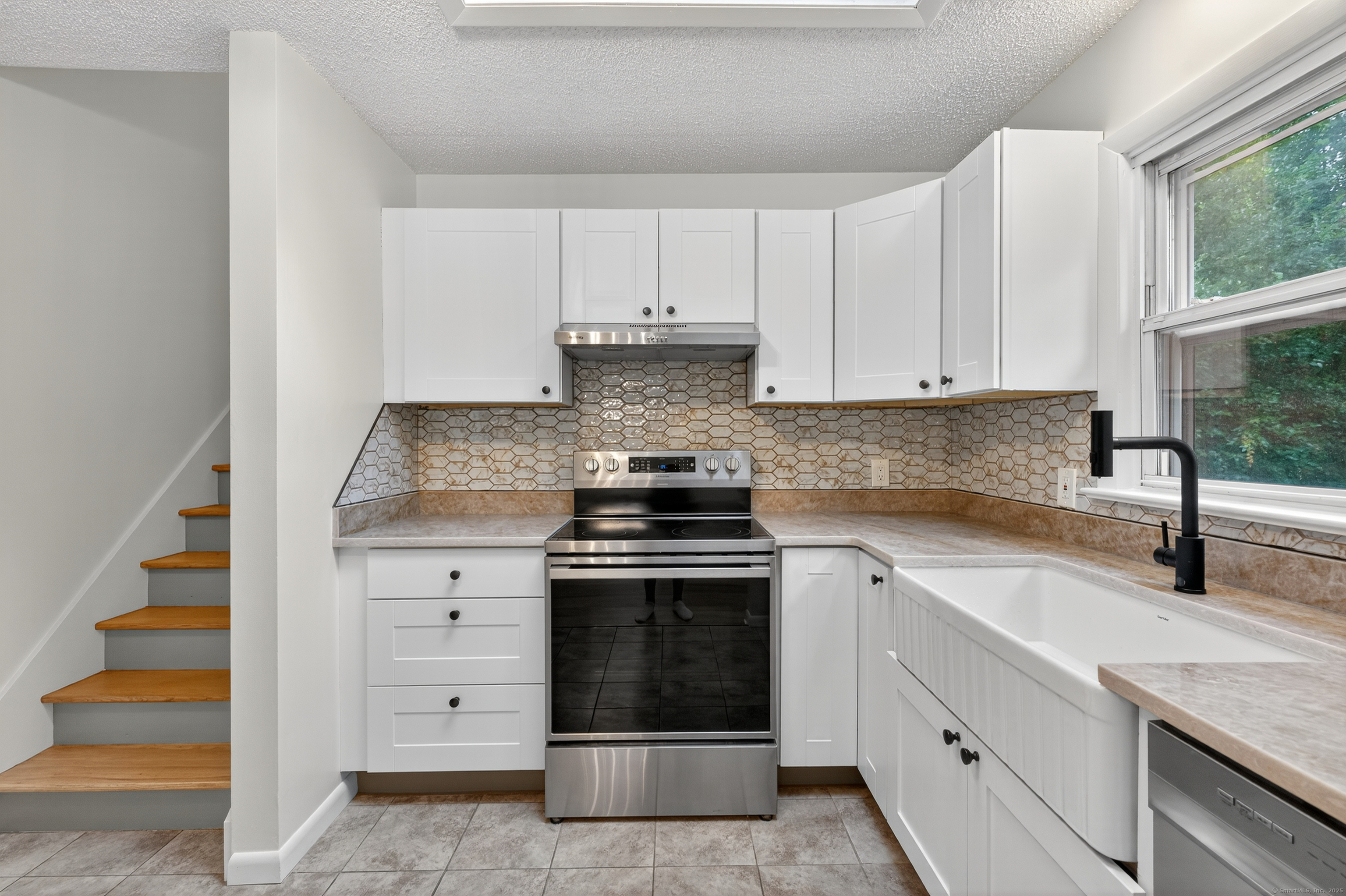3 Webster Drive 1 Preston, CT 06365 - Photo 13 of 37 a kitchen with white cabinets and appliances