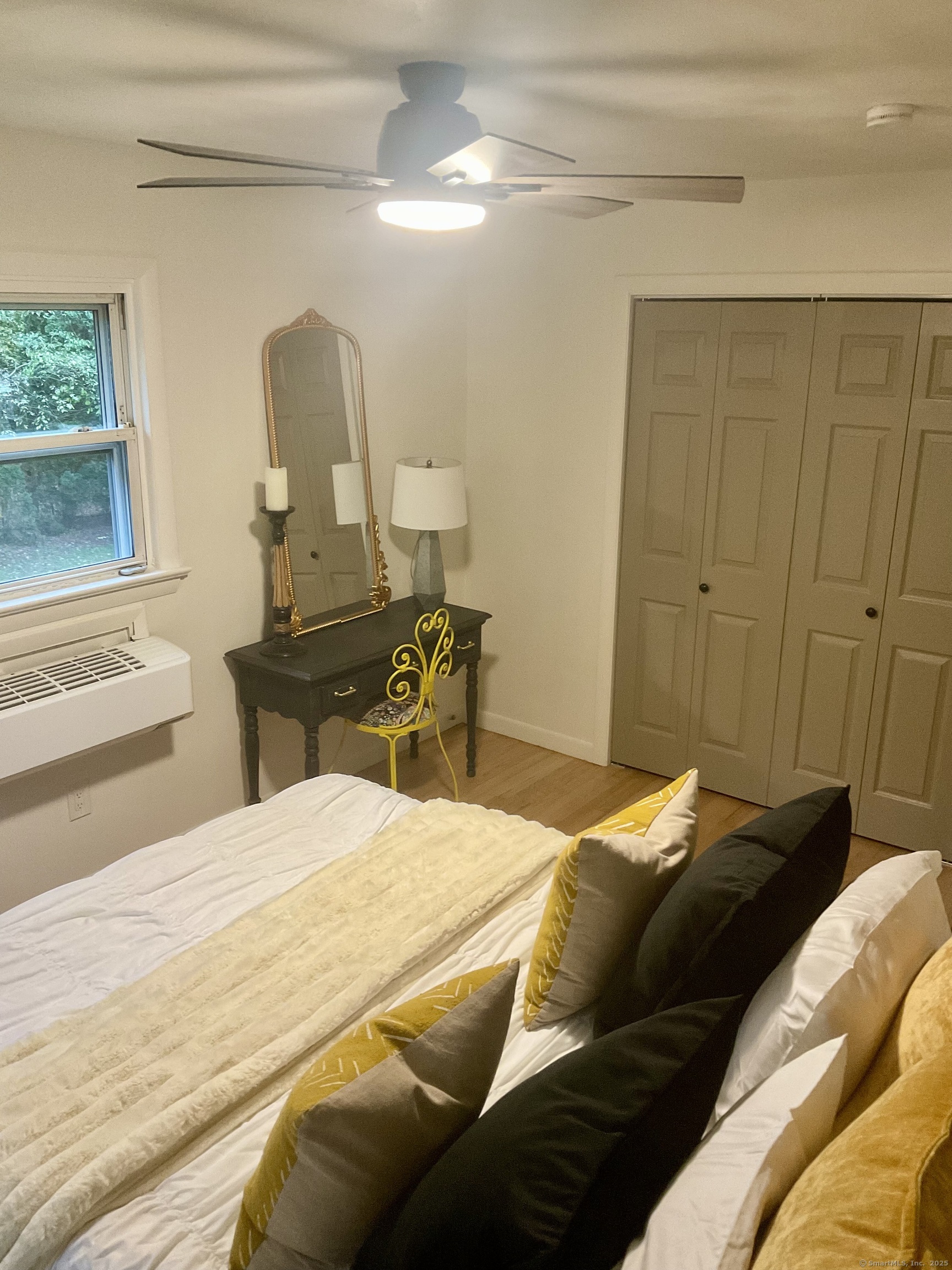 3 Webster Drive 1 Preston, CT 06365 - Photo 14 of 37 a bedroom with a bed a mirror and a window