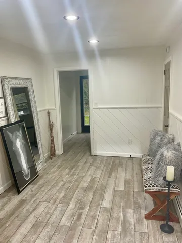 a view of a livingroom with wooden floor