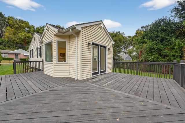 a view of deck with wooden floor and fence