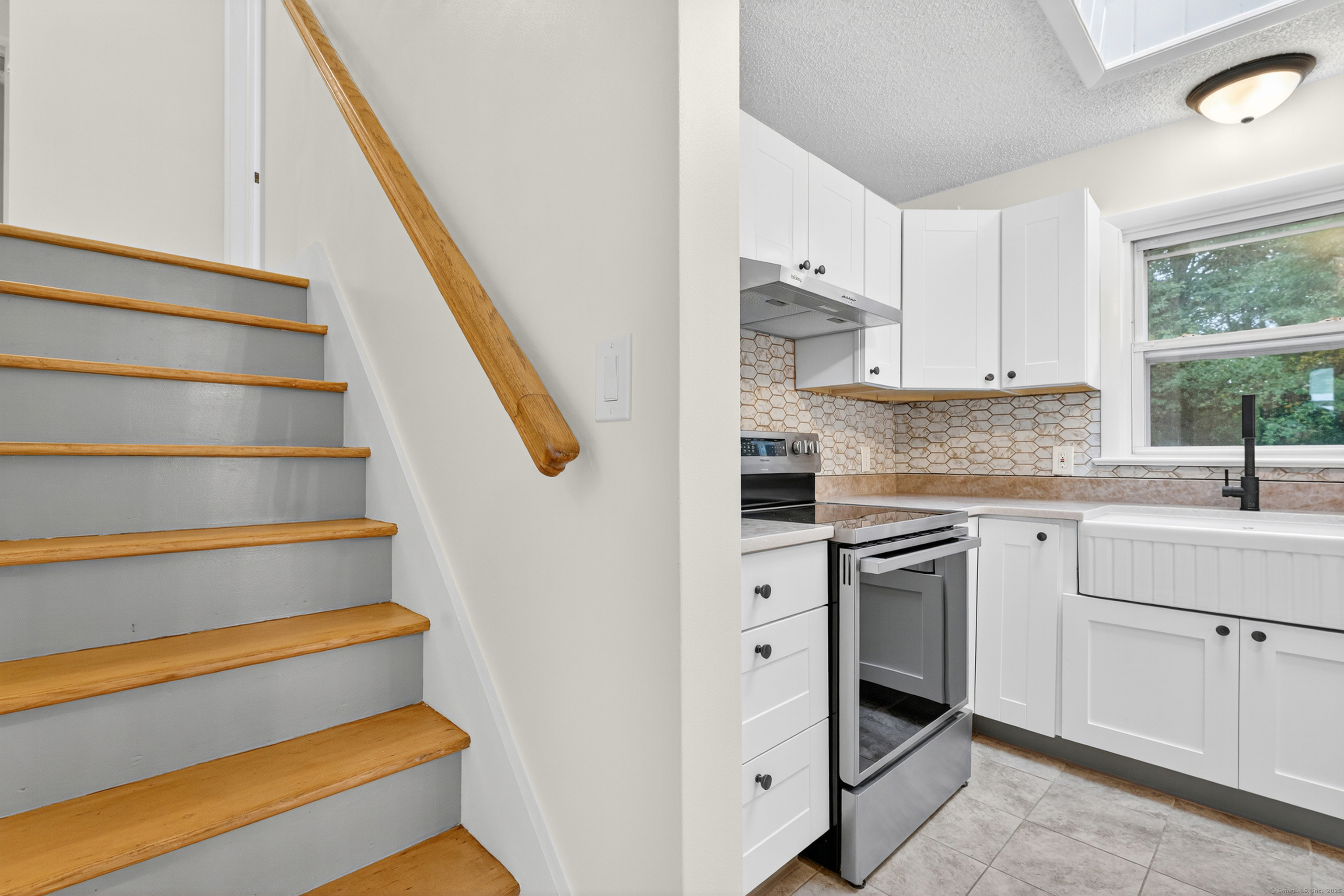 3 Webster Drive 1 Preston, CT 06365 - Photo 25 of 37 a kitchen with white cabinets and white appliances