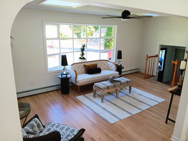 a living room with furniture and a window