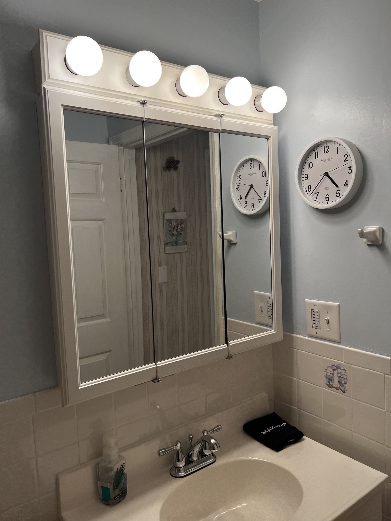 3745 Holmes Creek Road Smithville, TN 37166 - Photo 15 of 23 a bathroom with a sink and a mirror